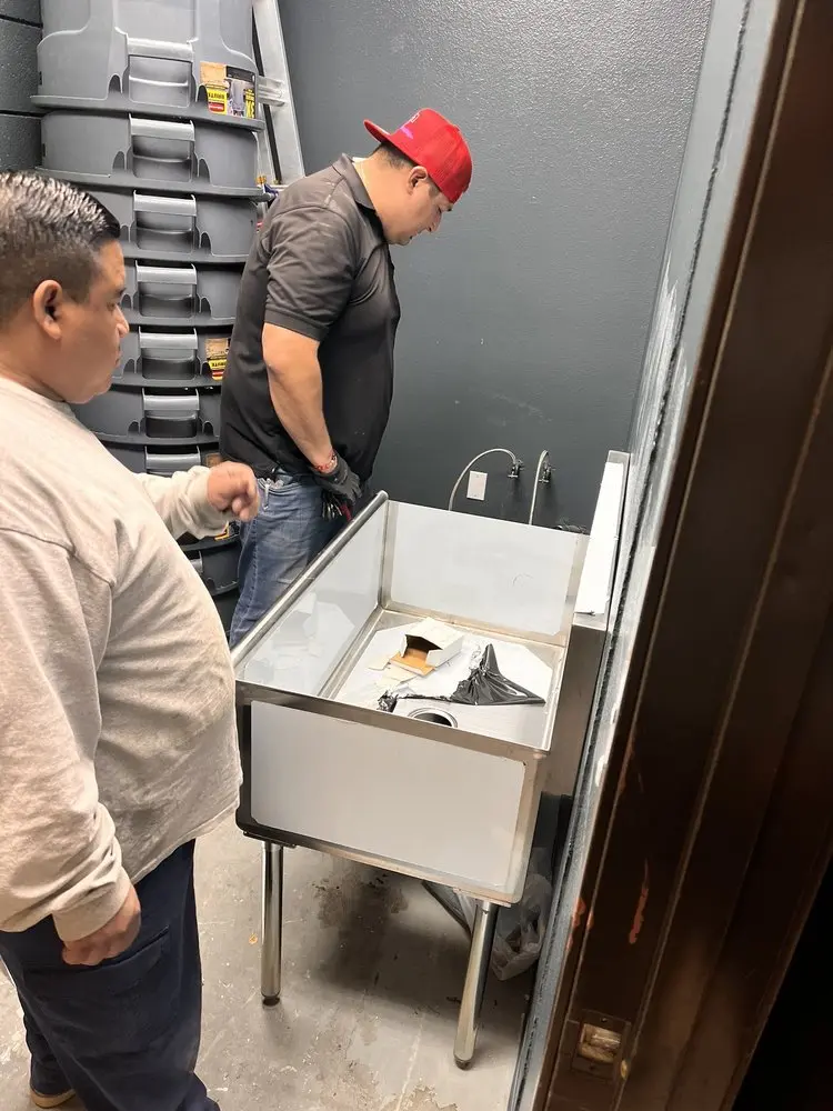 Commercial plumbing and sink installation in Covington